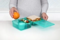 41745_2L_LUNCH_LunchCubeMax_Lifestyle_Bench_Food_Open_Hands_Teal.JPG